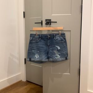 Distressed blue jean shorts